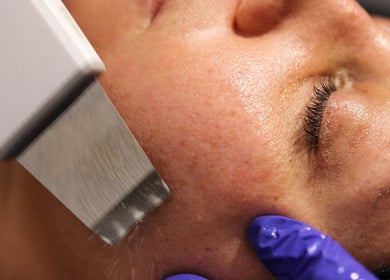 Facial treatment at Nios Spa, New York, New York, US, using advanced skincare technology for enhanced skin radiance.