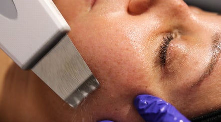 Facial treatment at Nios Spa, New York, New York, US, using advanced skincare technology for enhanced skin radiance.