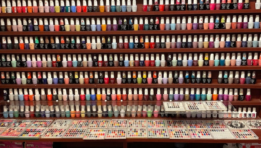 Colorful nail polish selection at Nail Place 4U, New York, New York, US, showcasing diverse manicure options.