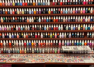 Diverse nail polish collection at Nail Place 4U in New York, New York, US offers vibrant color choices.