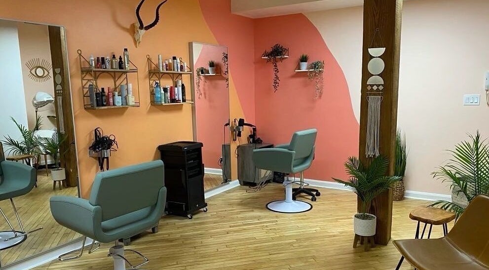 Stylish salon interior at Sarah Helena, Toronto, Ontario, CA, featuring modern chairs and decor.