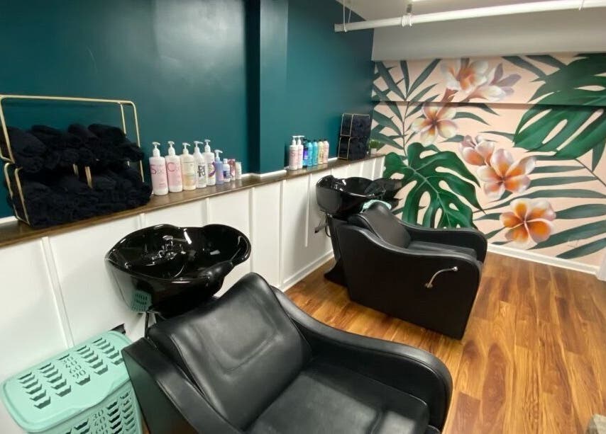Chic beauty salon wash station with tropical decor at Sarah Helena in Toronto, Ontario, CA.