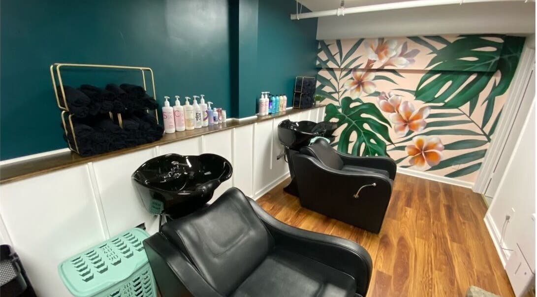 Chic beauty salon wash station with tropical decor at Sarah Helena in Toronto, Ontario, CA.
