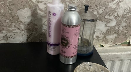 Nail Kouture beauty products displayed on a black surface in Wolverhampton, England, GB.