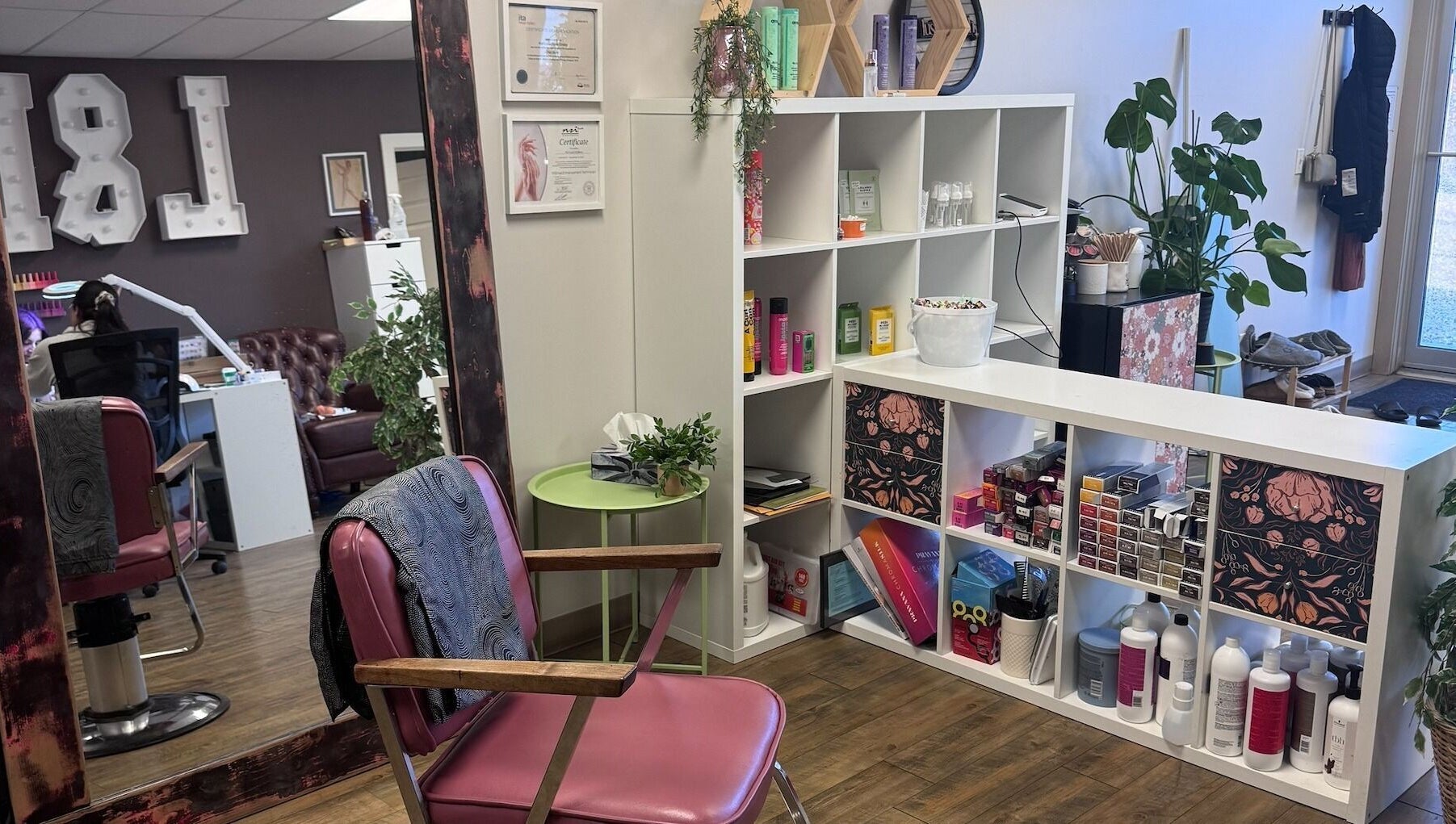 Stylish salon interior at Lustre&Lush, Elkford, BC with modern decor and beauty products displayed.