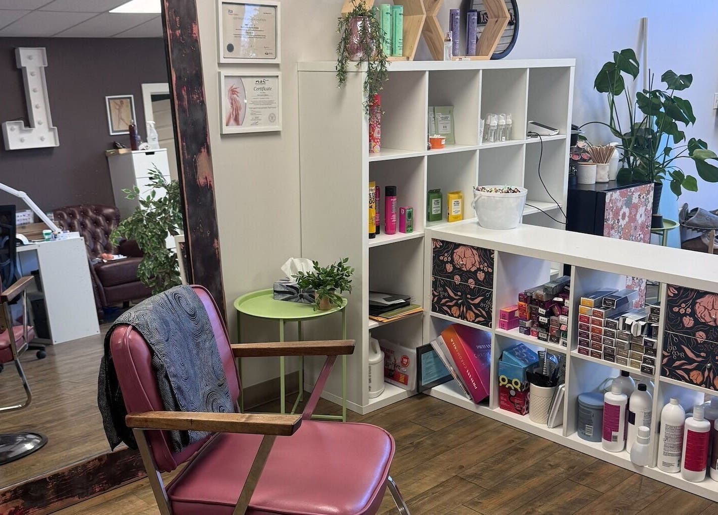 Stylish salon interior at Lustre&Lush, Elkford, BC with modern decor and beauty products displayed.
