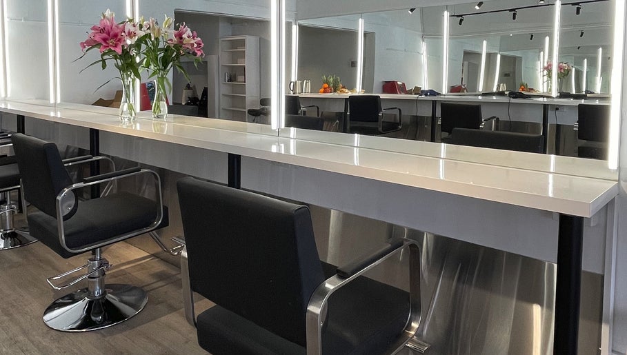 Styled seating and vanity at Ocean Hair Salon Design in Melbourne, Victoria, AU.