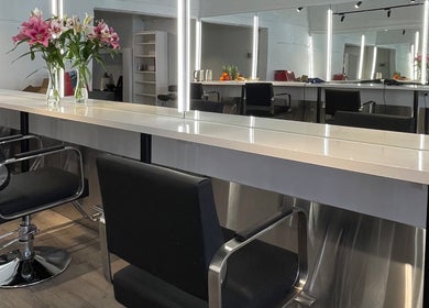 Styled seating and vanity at Ocean Hair Salon Design in Melbourne, Victoria, AU.