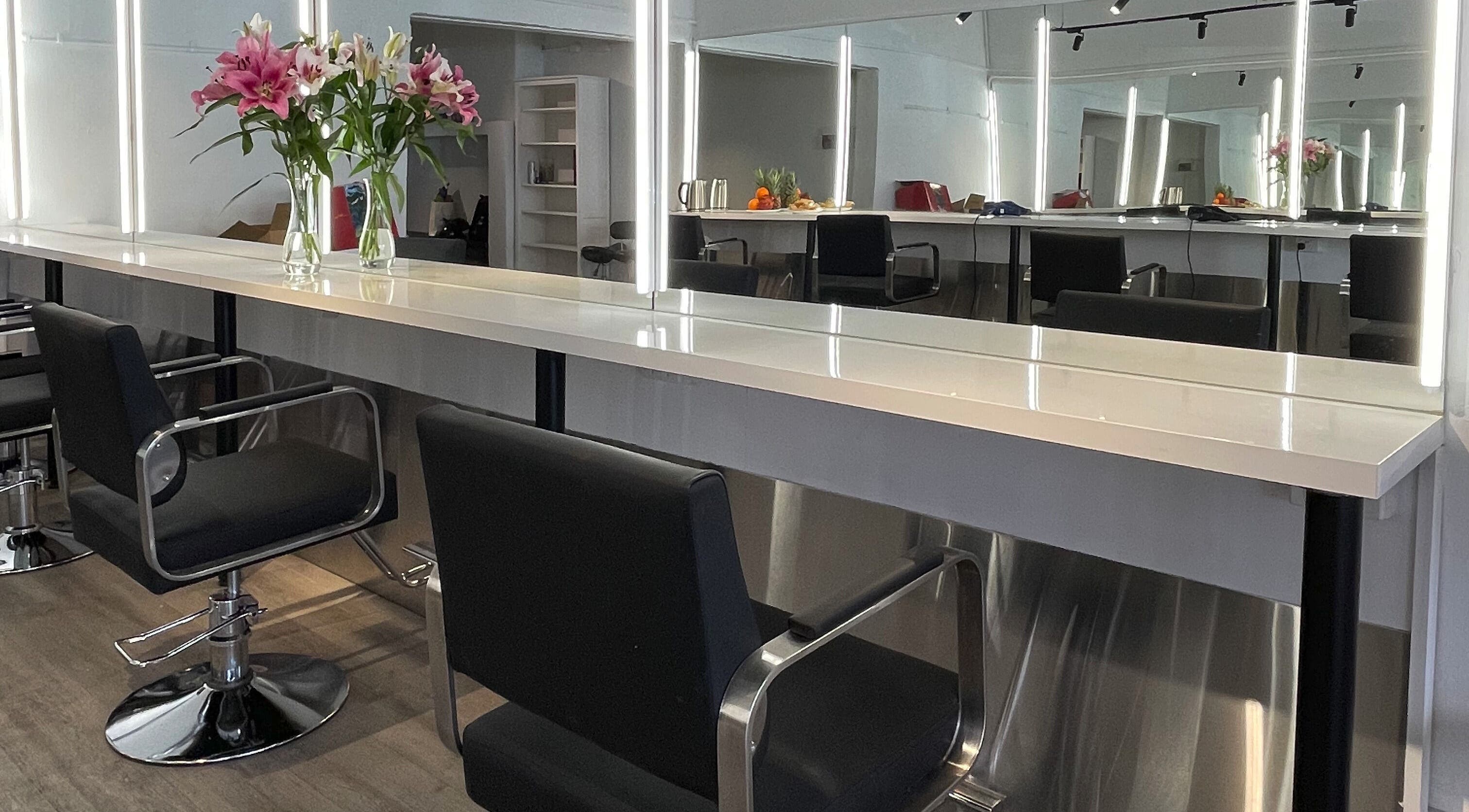 Styled seating and vanity at Ocean Hair Salon Design in Melbourne, Victoria, AU.