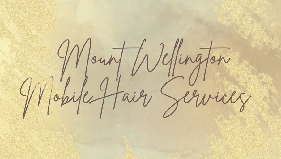 Elegant script of Mount Wellington Mobile Hair Services in Auckland, Auckland, NZ on a golden background.
