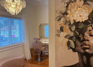 Elegant beauty chair and floral art at Embreis Beauty, Auckland, NZ.