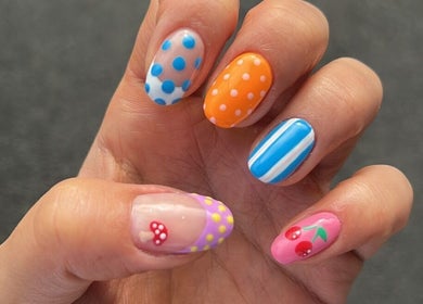 Colorful nail art with polka dots and cherries at Gym Bunny Nails, Auckland, NZ.