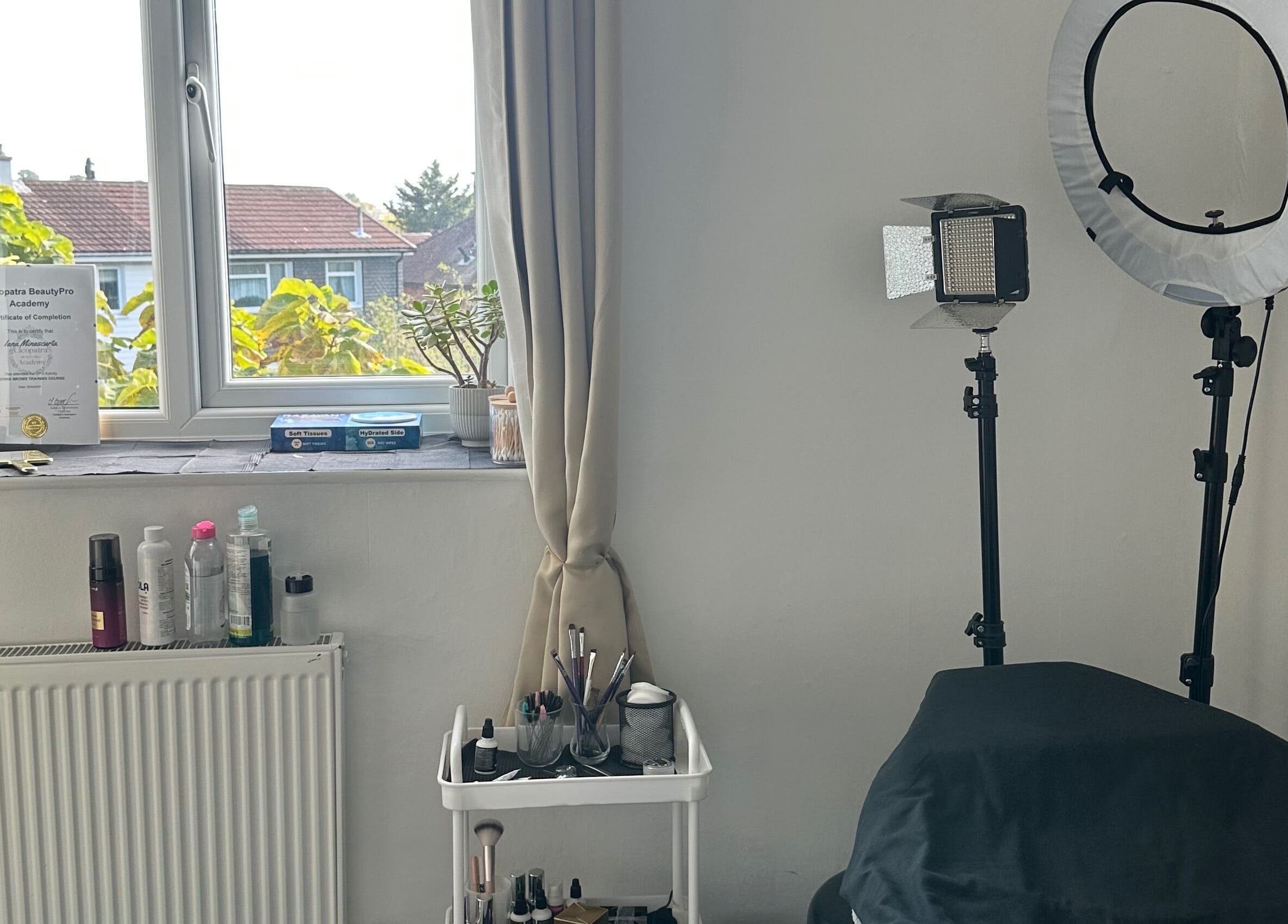 Cozy beauty room setup at Perfect Brows in Ilford, England, GB, featuring makeup and lighting tools.