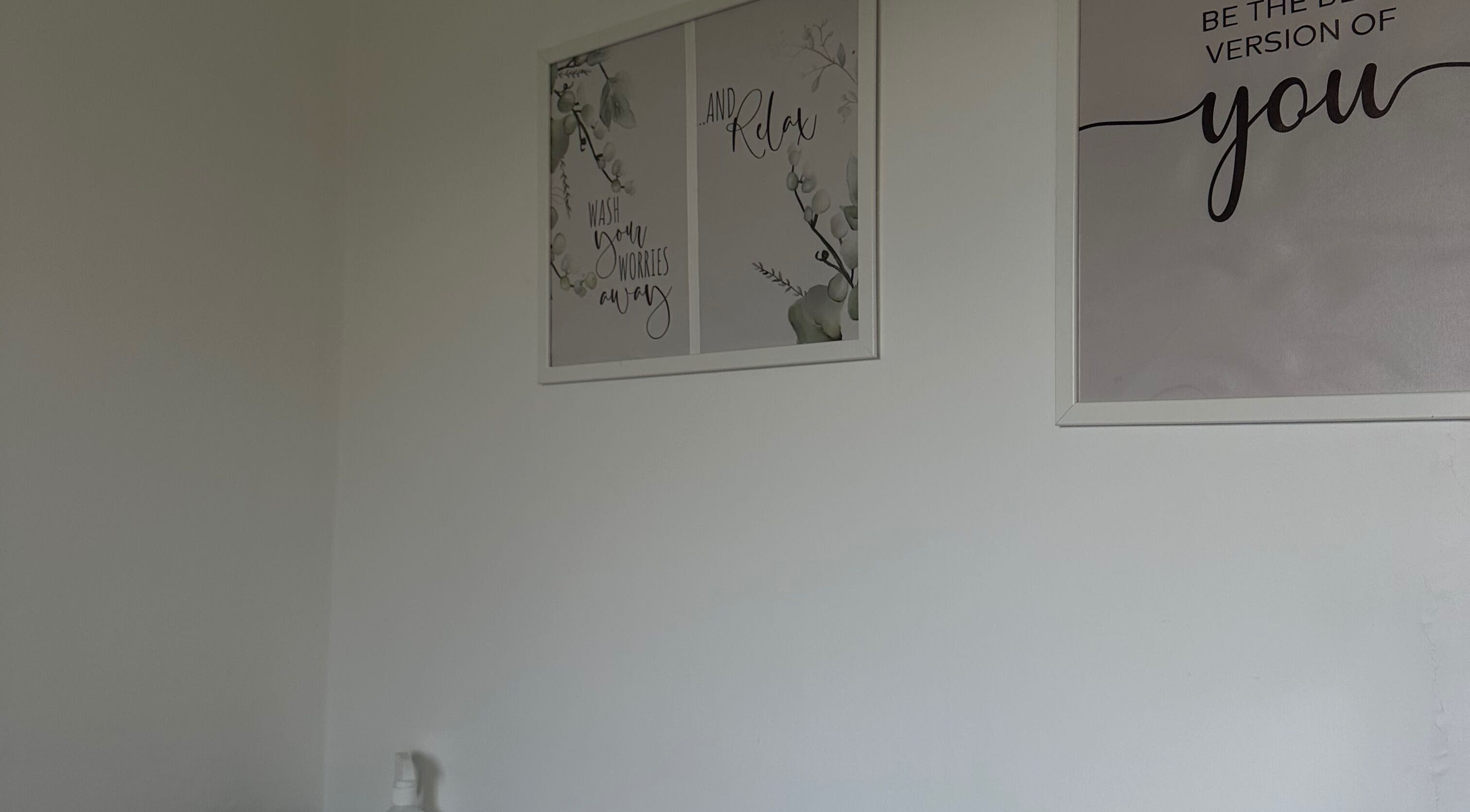 Calming decor at Perfect Brows, Ilford, England, GB with motivational wall art.