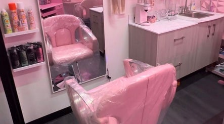 BB Boutique salon interior in Portland, Oregon with stylish pink chairs and modern amenities.