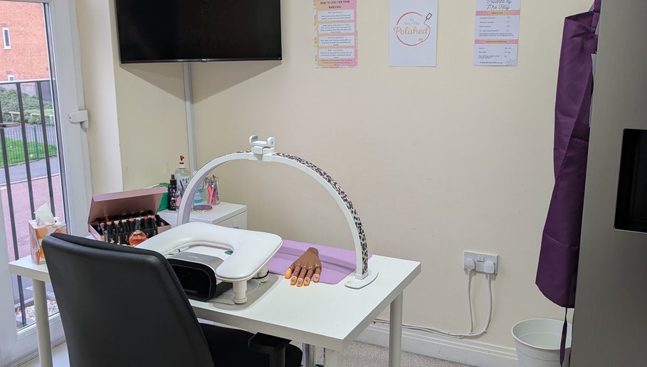 Nail station at Polished by Mrs Hilly in Stockport, England, GB, featuring manicure tools and cozy setup.