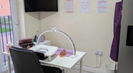 Nail station at Polished by Mrs Hilly in Stockport, England, GB, featuring manicure tools and cozy setup.