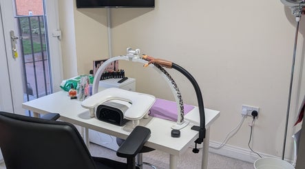 Nail station at Polished by Mrs Hilly, Stockport, England, GB, featuring modern tools and comfortable seating.