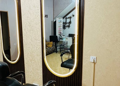 Stylish salon interior with illuminated mirror at Inakshi Mendis Salons, Negombo, Western Province, LK.