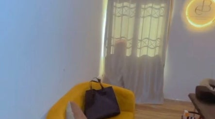Cozy seating area at EverythingblessingXaesthetic, Lekki, Lagos, NG, with a yellow chair and soft lighting.