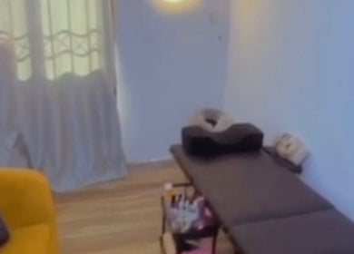 Cozy treatment room at EverythingblessingXaesthetic in Lekki, Lagos, NG featuring massage bed and ambient lighting.