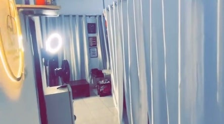 Bright, tranquil room at Everythingblessing Xaesthetic, Lekki, Lagos, NG, featuring elegant curtains and relaxing decor.