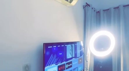 Bright ring light and smart TV at Everythingblessing Xaesthetic, Lekki, Lagos, NG, creating a chic ambiance.