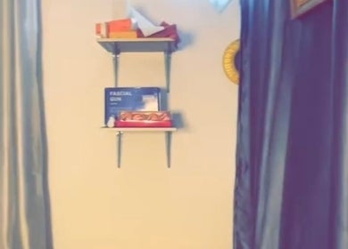 Shelves with wellness products at Everythingblessing Xaesthetic, Lekki, Lagos, NG. Ambiance with soothing curtains.
