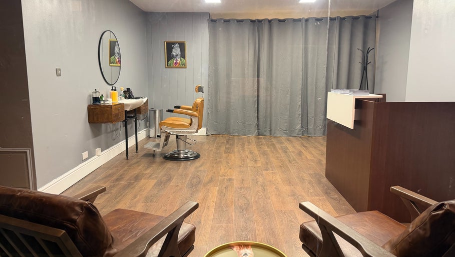 Stylish interior of Sina Grooming Atelier featuring an elegant salon chair in Winchester, England, GB.