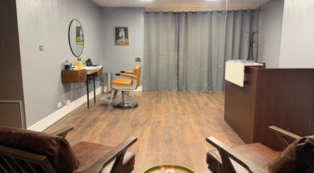 Stylish interior of Sina Grooming Atelier featuring an elegant salon chair in Winchester, England, GB.
