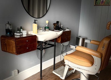 Elegant barber chair and sink at Sina Grooming Atelier, Winchester, England, GB.