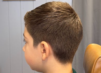 Youthful haircut at Sina Grooming Atelier, Winchester, England, GB showcasing professional styling.