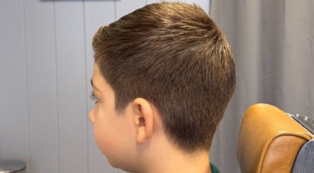 Youthful haircut at Sina Grooming Atelier, Winchester, England, GB showcasing professional styling.