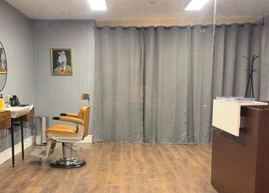 Elegant interior of Sina Grooming Atelier with styling chair in Winchester, England, GB.