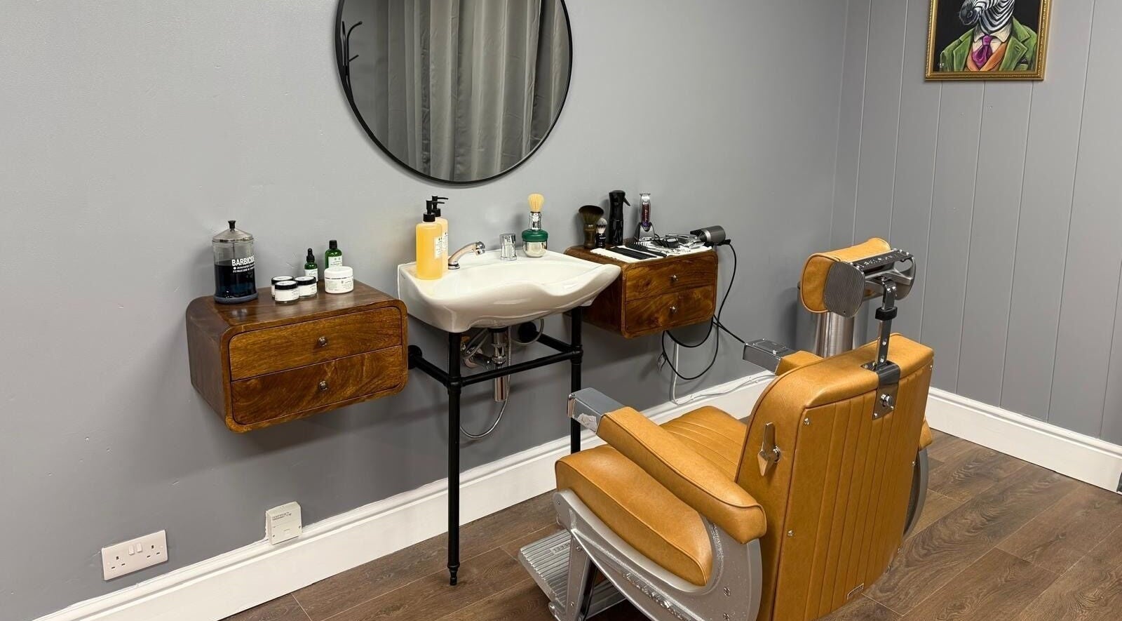 Retro barber chair at Sina Grooming Atelier, Winchester, England, GB with vintage decor and grooming tools.