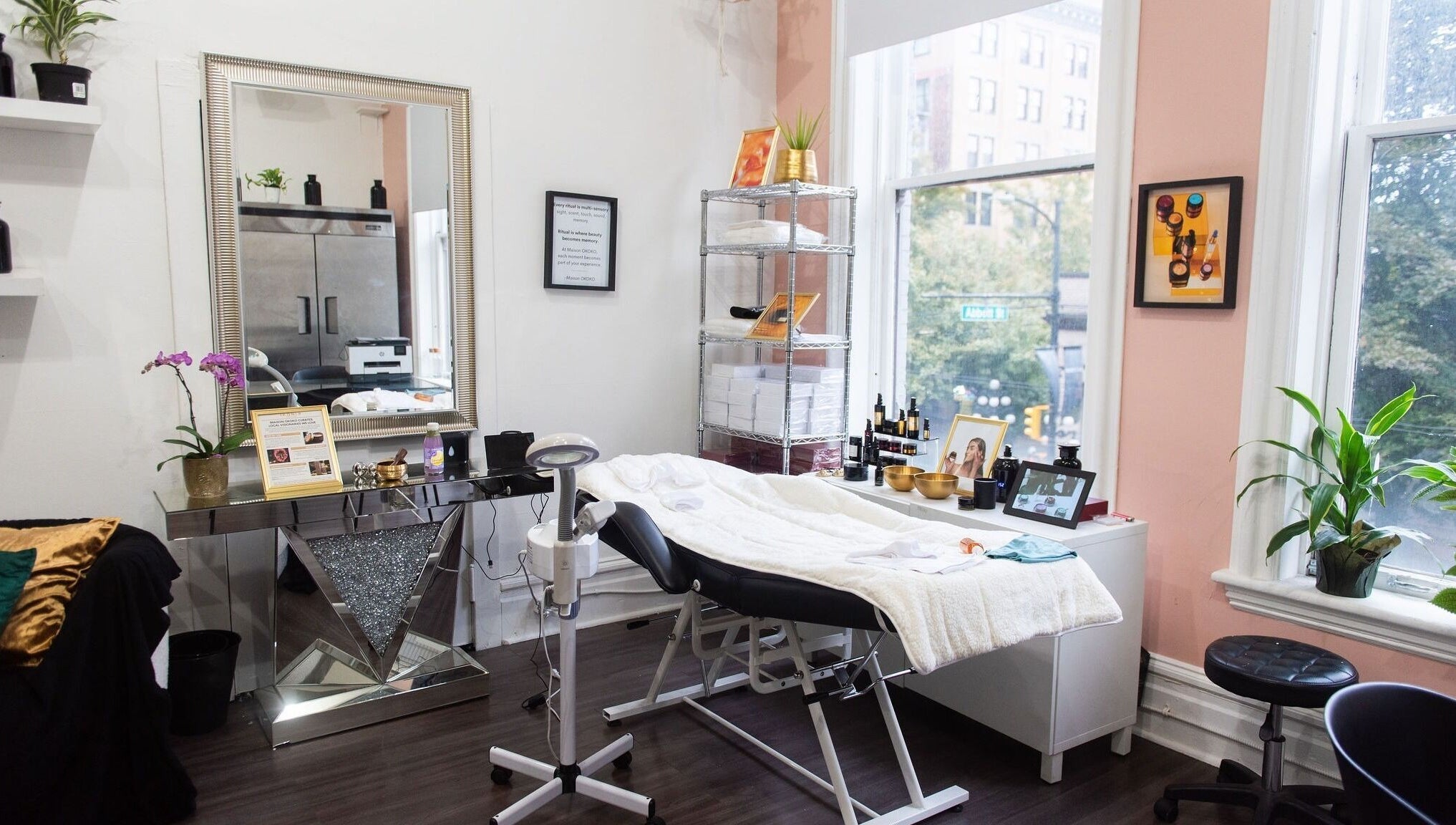 Relaxing therapy room at Maison OKOKO, Vancouver, British Columbia, CA, featuring a cozy treatment bed and elegant decor.