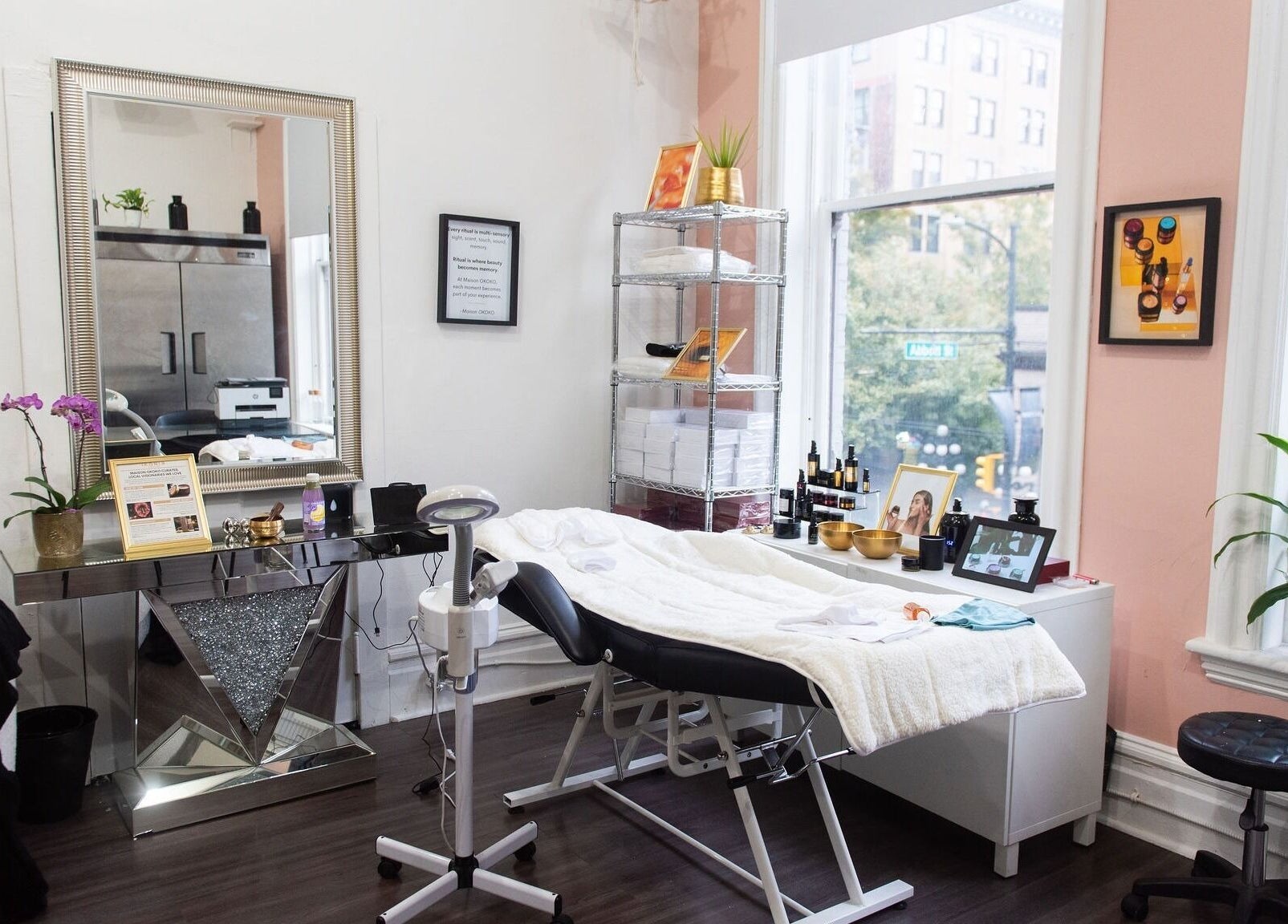 Relaxing therapy room at Maison OKOKO, Vancouver, British Columbia, CA, featuring a cozy treatment bed and elegant decor.