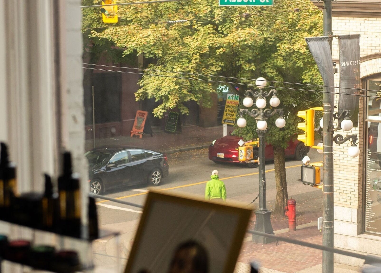 Street view from Maison OKOKO window, Vancouver, British Columbia, CA. Urban life and scenic beauty combined.