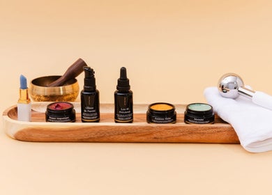 Luxury beauty products at Maison OKOKO, Vancouver, British Columbia, CA, arrayed on a sleek wooden tray.