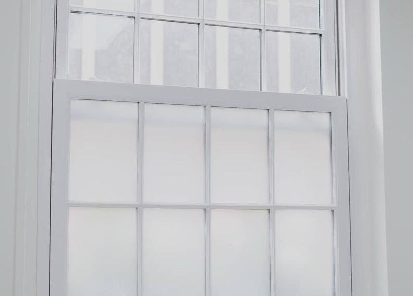 Bright window at Magi Brows & Lashes in Norwich, England, GB illuminating the wellness space.