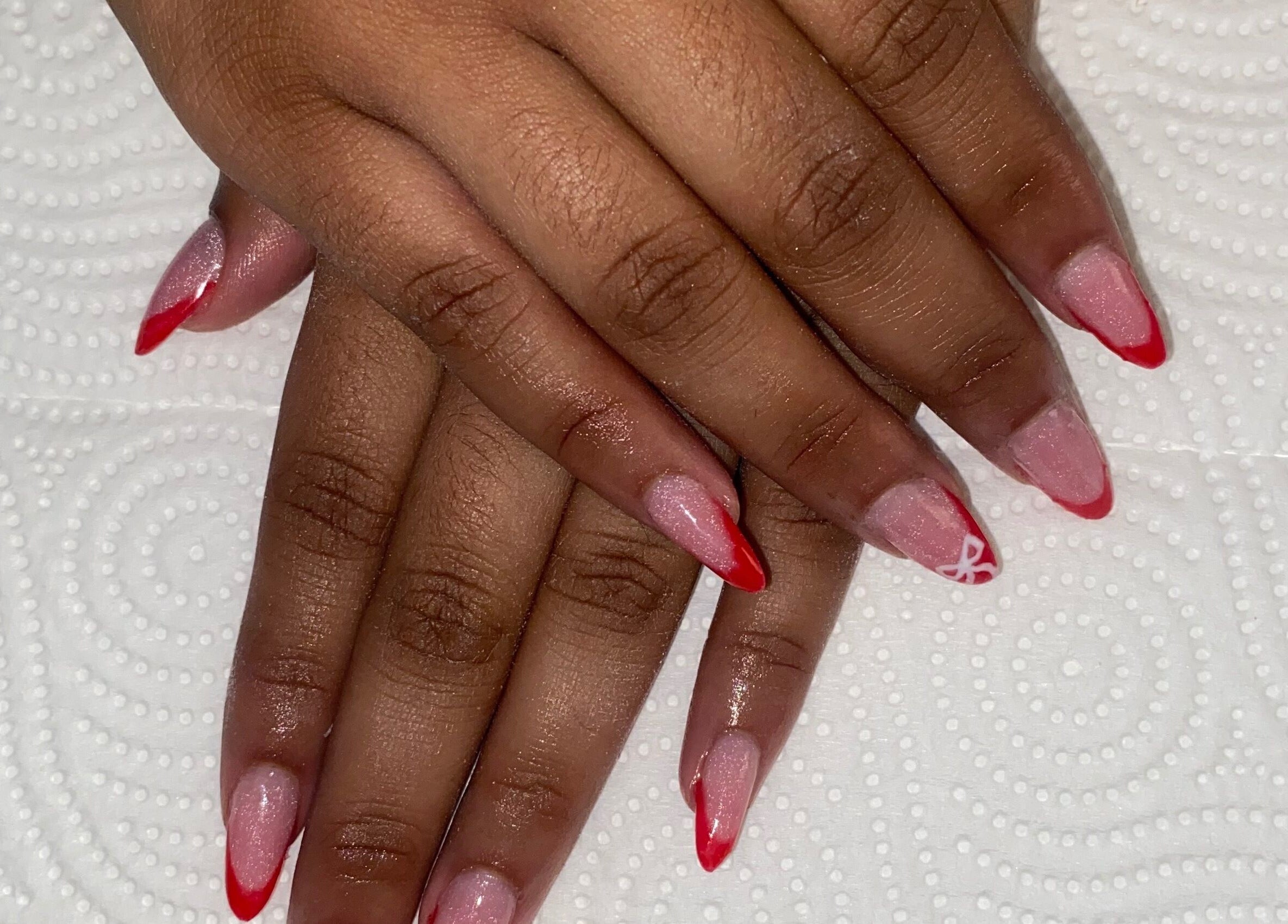 Stylish red-tipped nails at Claws & Effect, Randburg, Gauteng, ZA enhancing hand beauty.