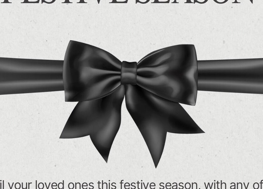 Black ribbon with festive bow at Claws & Effect, Randburg, Gauteng, ZA for the holiday season.
