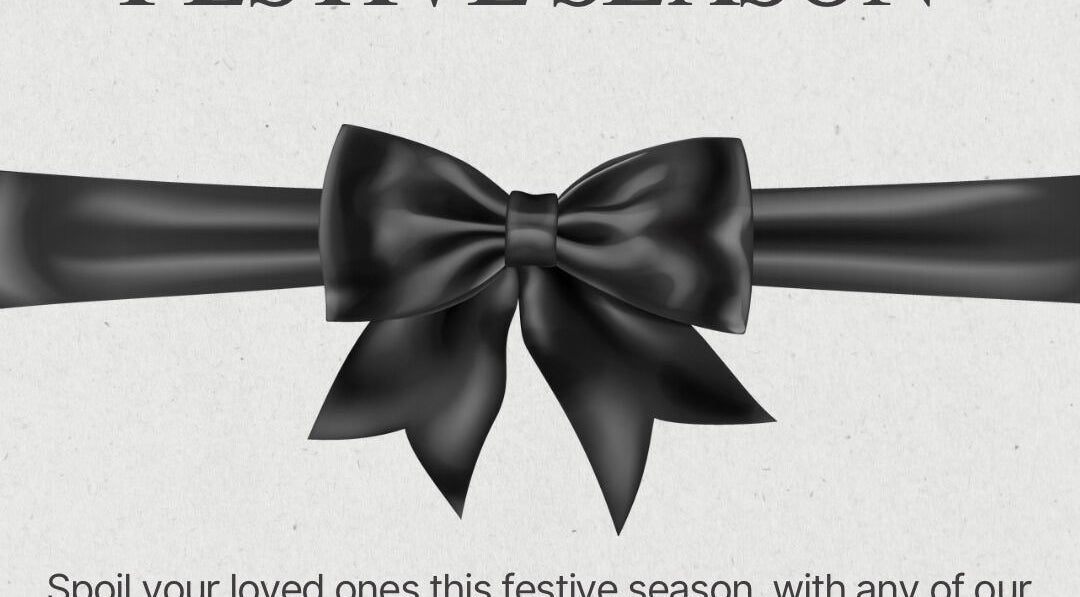Black ribbon with festive bow at Claws & Effect, Randburg, Gauteng, ZA for the holiday season.