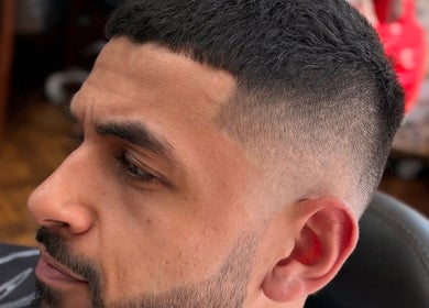 Close-up of a stylish fade haircut at Andi.hair.hustler, Birkenhead, England, GB, showcasing precise detailing.