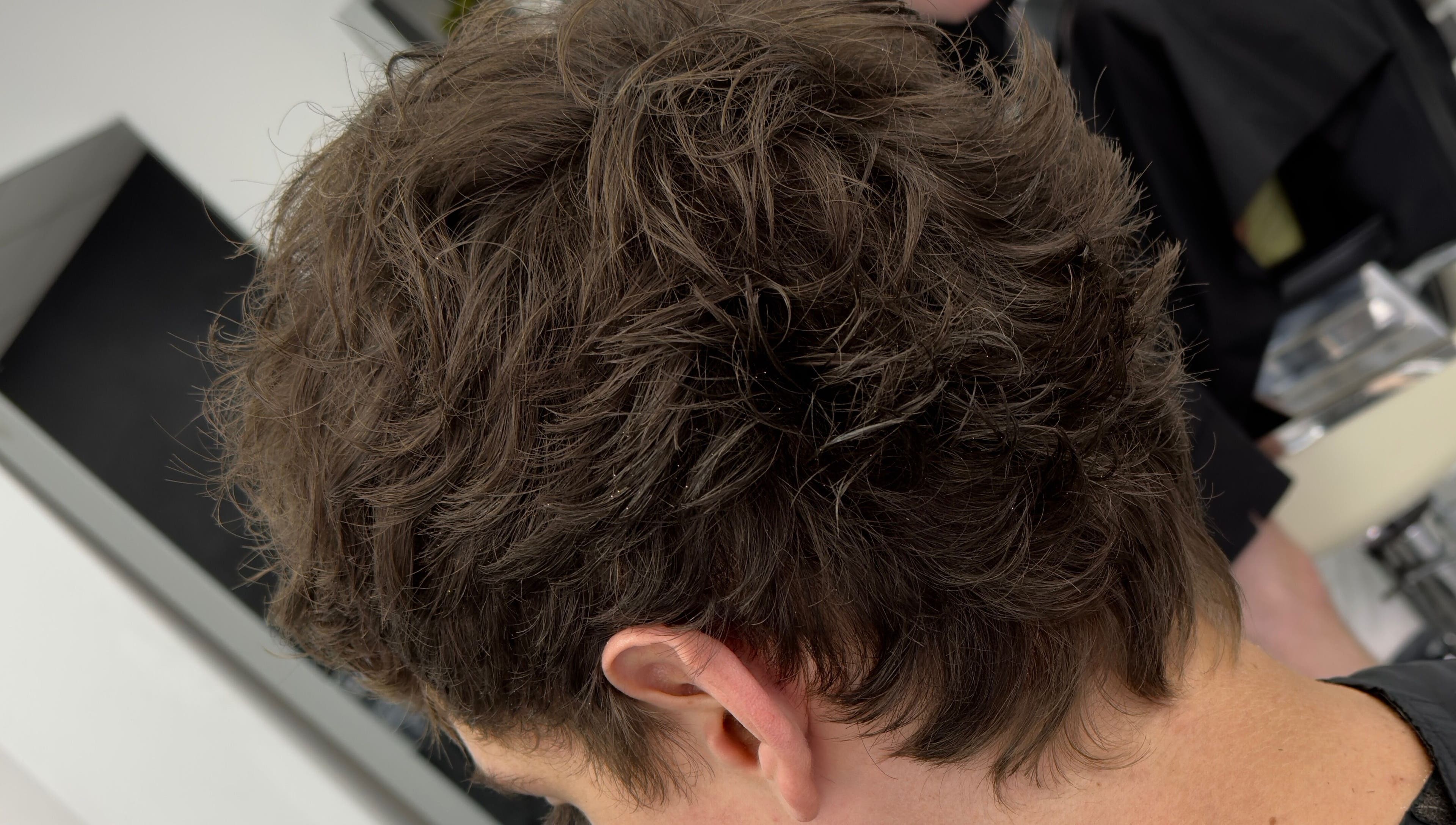Close-up of textured hairstyle at Andi.hair.hustler, Birkenhead, England, GB, showcasing skilled cutting.