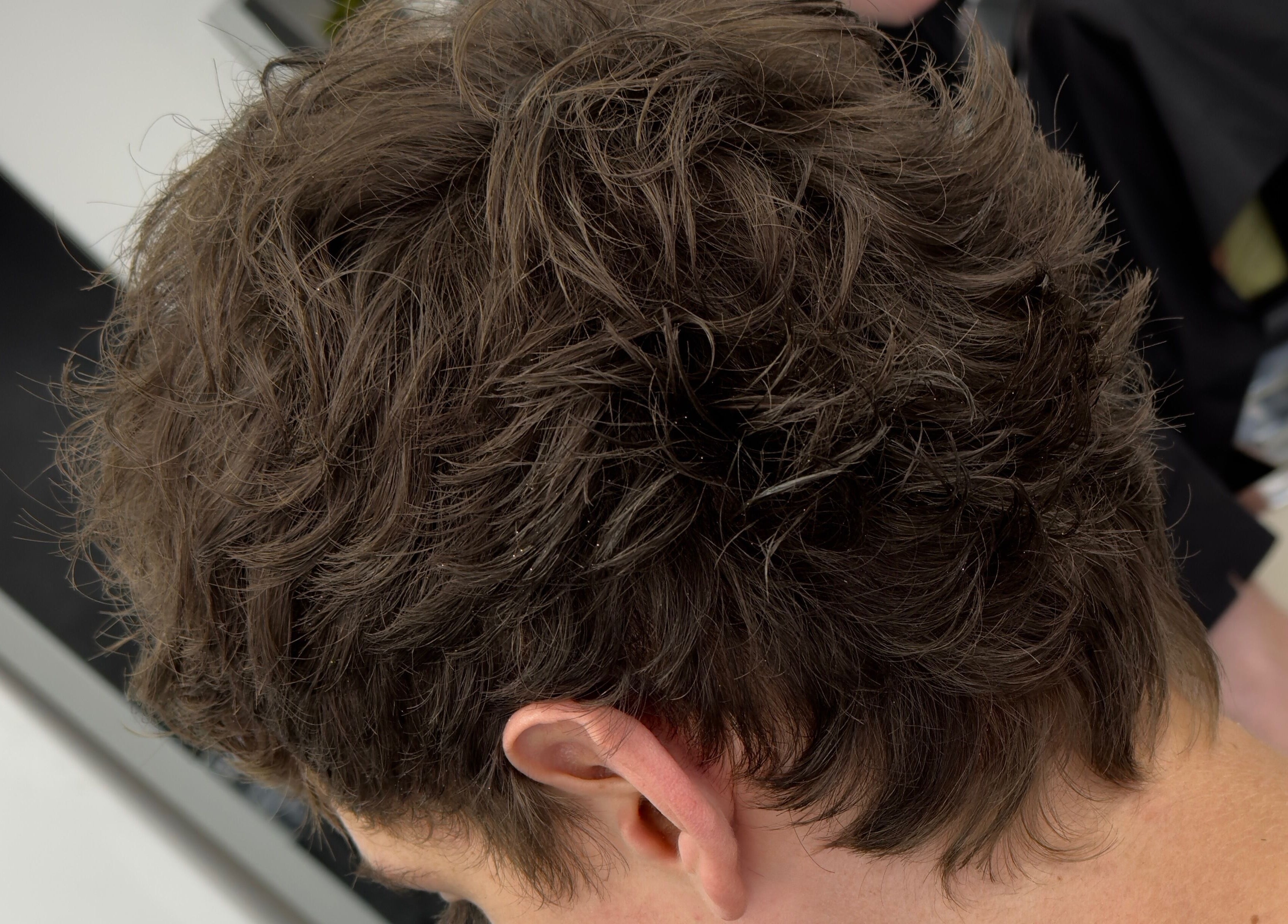 Close-up of textured hairstyle at Andi.hair.hustler, Birkenhead, England, GB, showcasing skilled cutting.