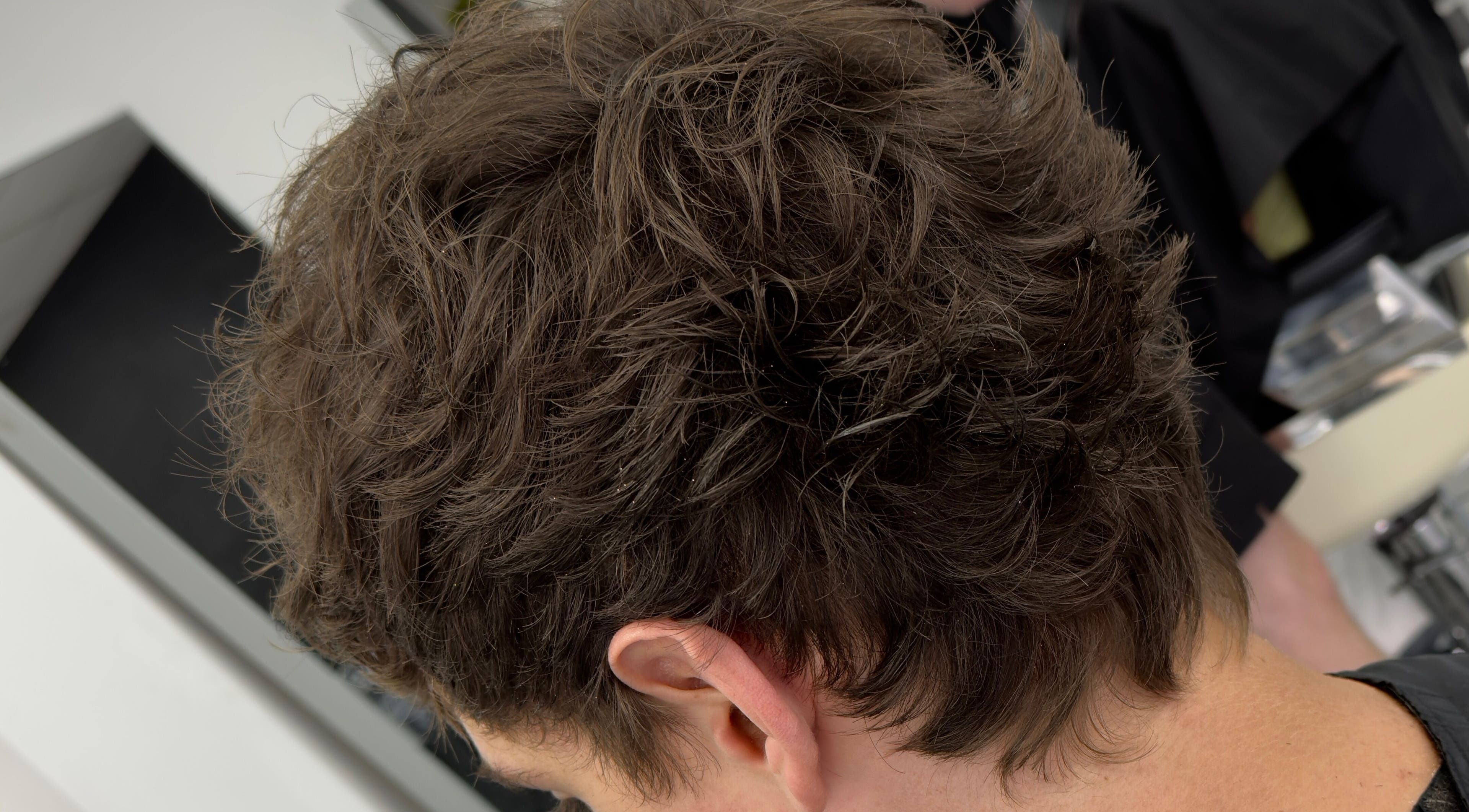 Close-up of textured hairstyle at Andi.hair.hustler, Birkenhead, England, GB, showcasing skilled cutting.