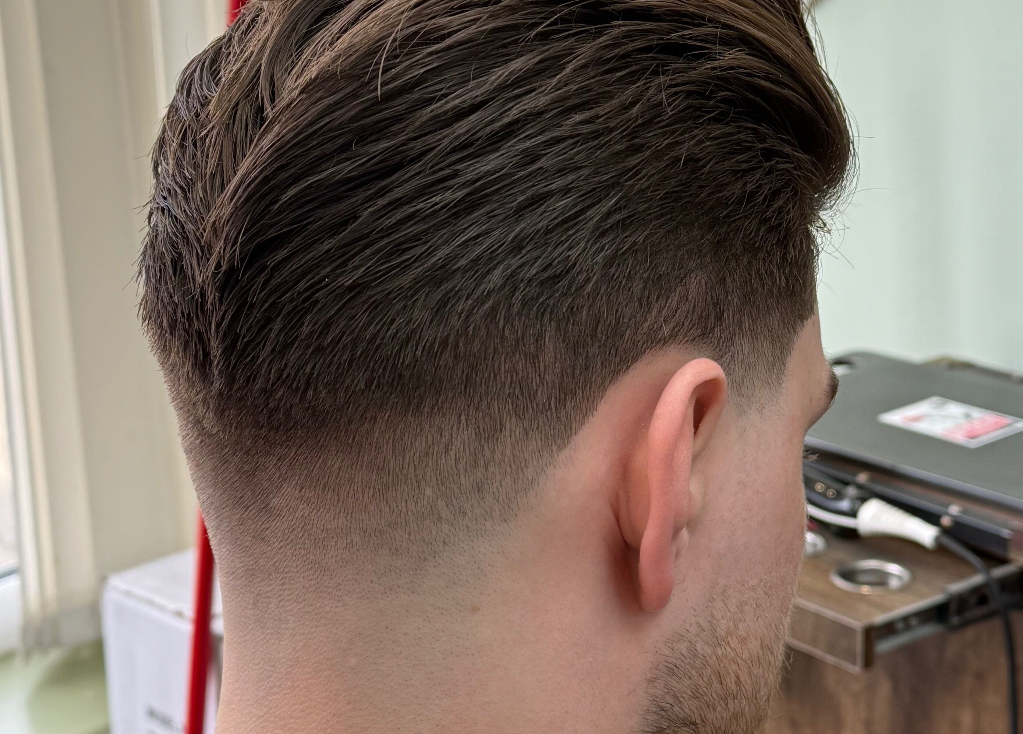 Close-up of a stylish men's fade haircut at Andi.hair.hustler, Birkenhead, England, GB.