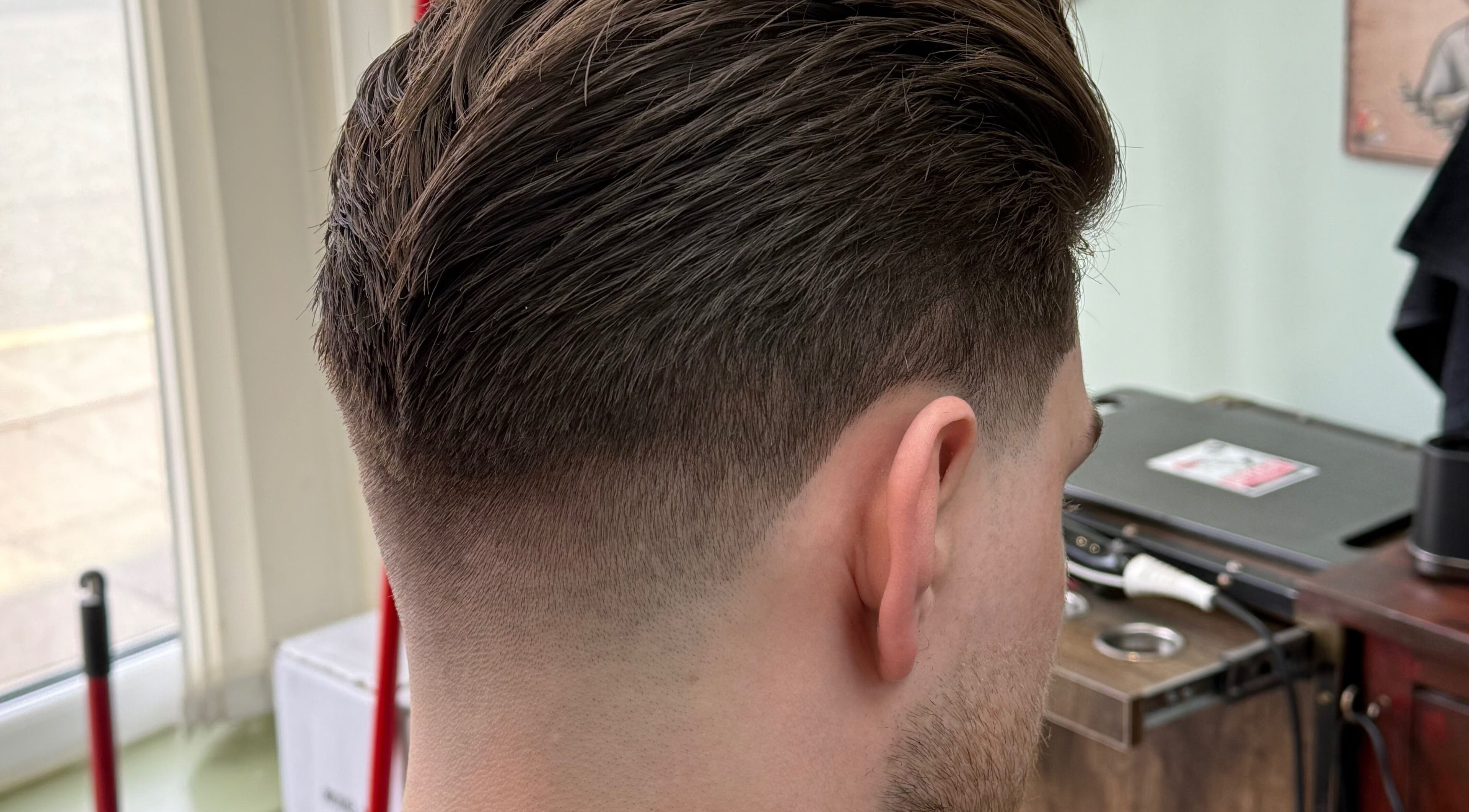 Close-up of a stylish men's fade haircut at Andi.hair.hustler, Birkenhead, England, GB.