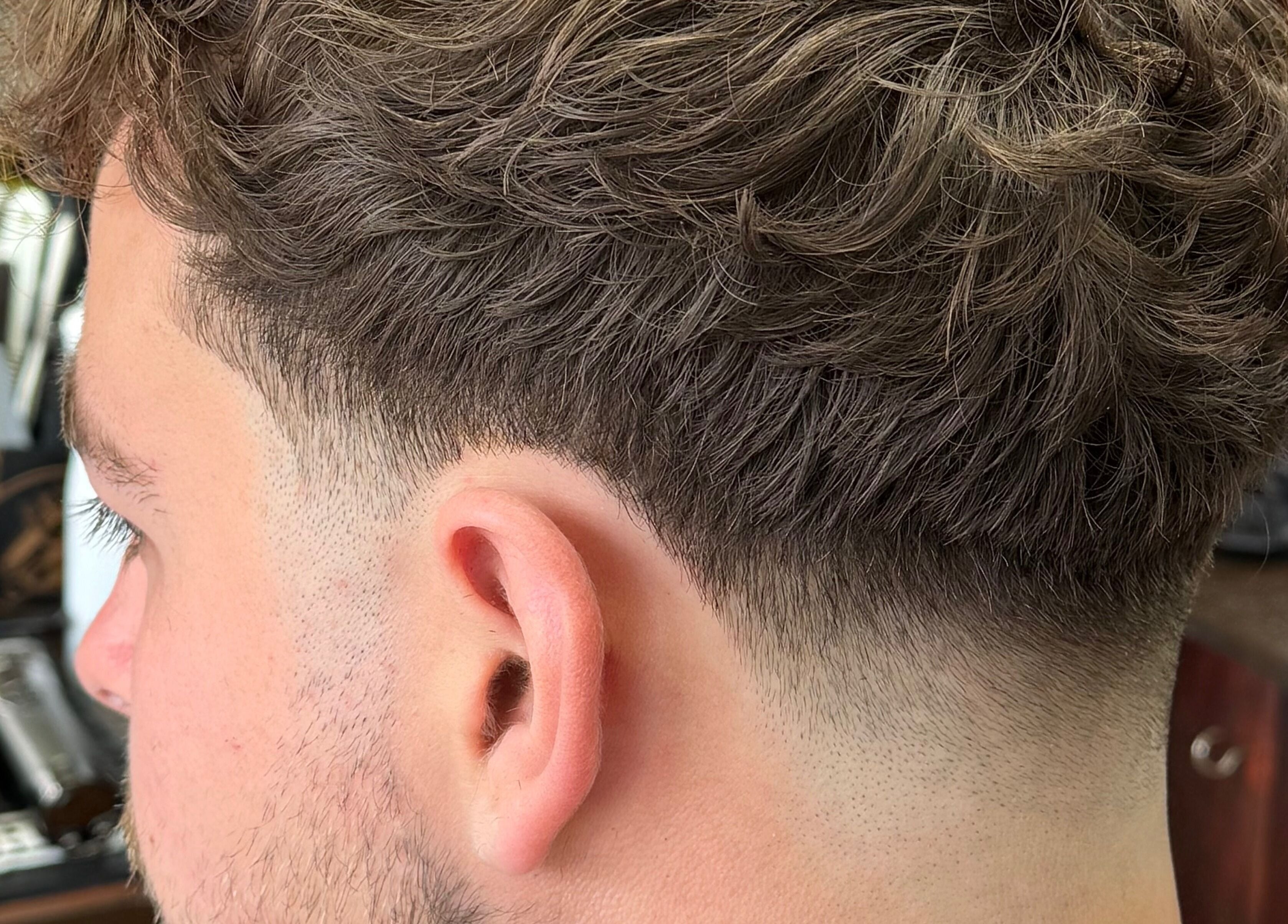 Close-up of a stylish men's fade haircut at Andi.hair.hustler, Birkenhead, England, GB.